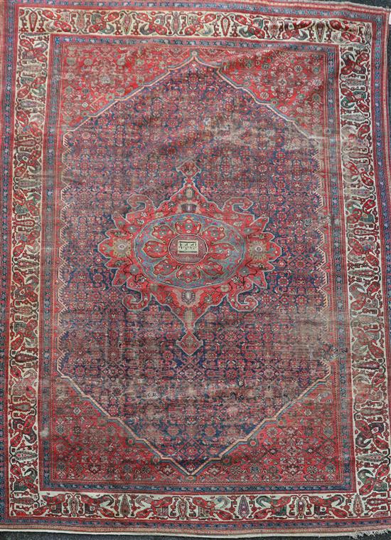 An antique Malayer carpet, dated 1905, 14ft 3in by 10ft 4in.